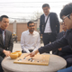 Go champion Ke Jie (far right) recreating the opening moves of one of AlphaGo’s games from last year. (Image: Deepmind)